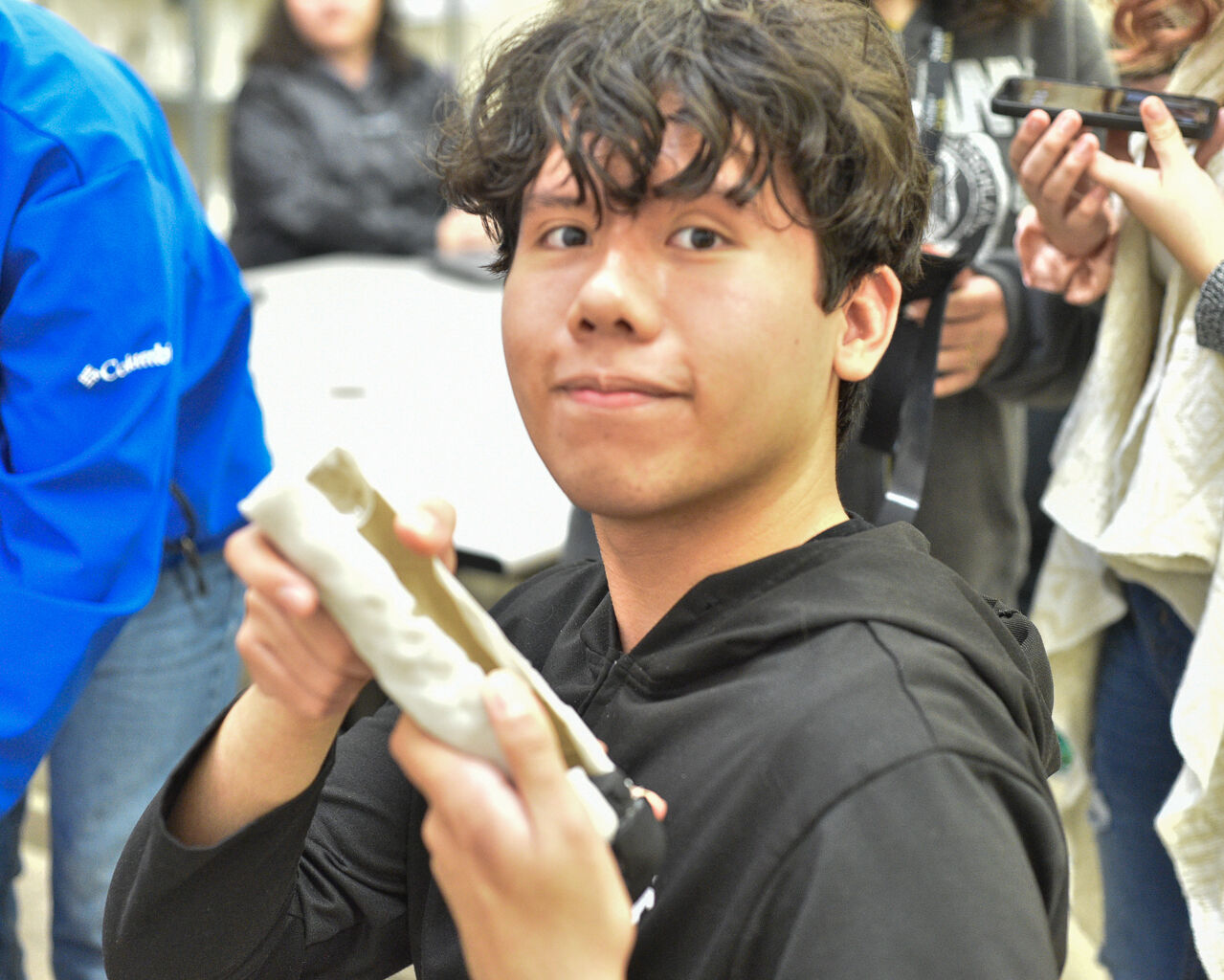 Marco Mendoza with his groups prosthetic